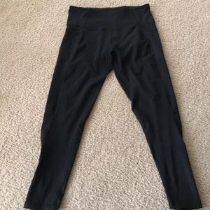 Black workout pants with zipper and pockets